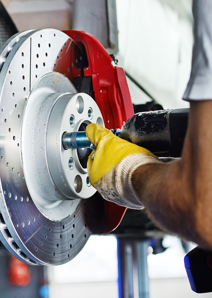 Close up of car brakes being repaired